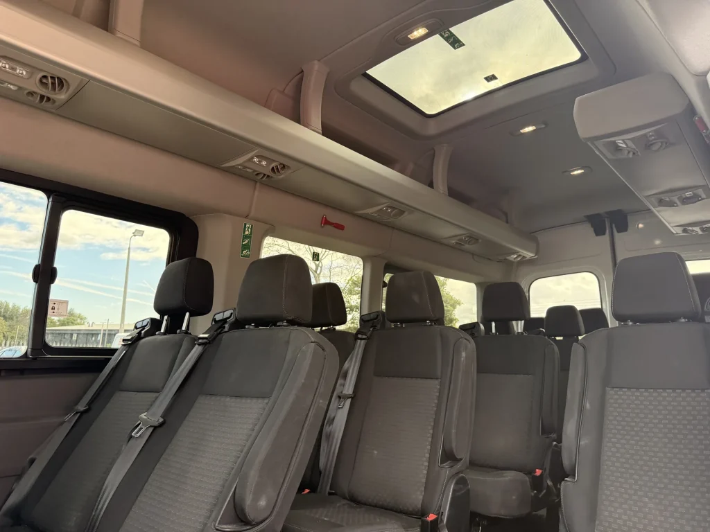Minibus passenger cabin with seating and ceiling windows