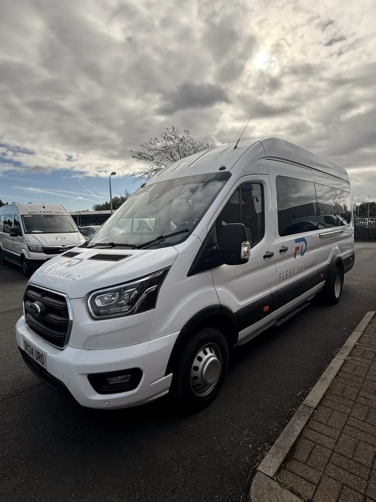 Fleet Dynamic Ford Transit 17-seater minibus, front three-quarter view